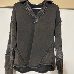 New in “patch” sweater